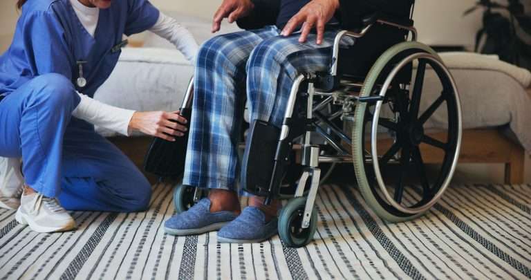 Hands, caregiver or shoes with wheelchair for support, elderly care or assisted living at retirement or old age home. Closeup, nurse or volunteer helping person with a disability for mobility or walk